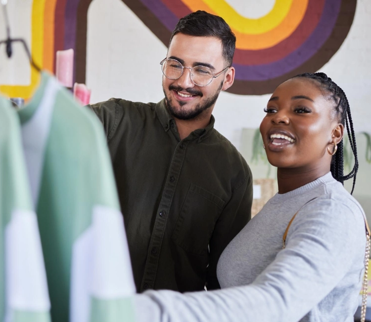 A woman at her desk uses Retail401k tools for multiple employer plan support.