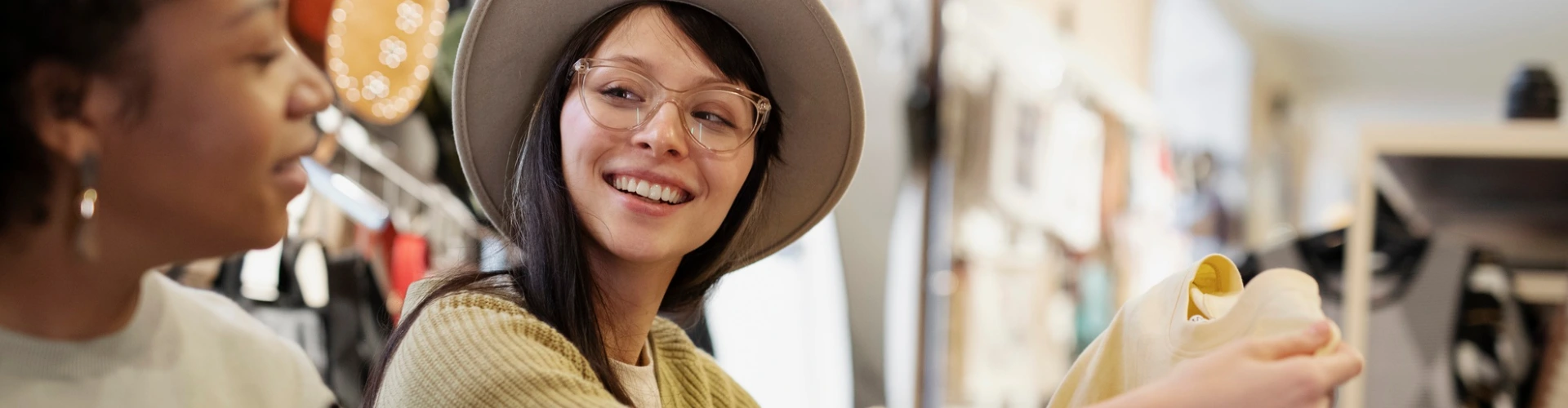 Two women viewing art reflect how Retail401k simplifies multiple employer plan options for small businesses.